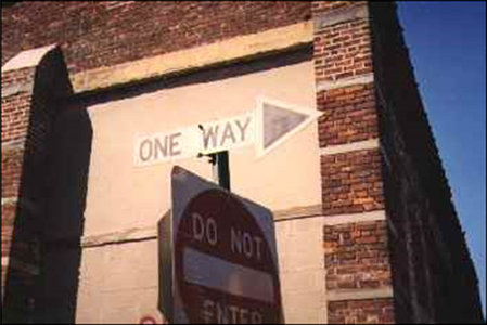 The arrow shaped one-way sign