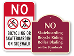 No Biking on Sidewalk Signs