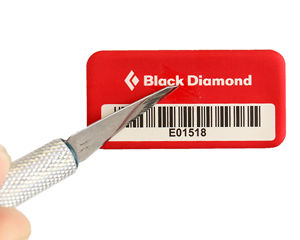 Anodized barcode label features sealed-in graphics