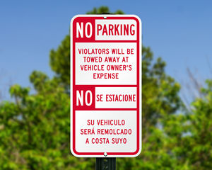 Bilingual tow away parking sign