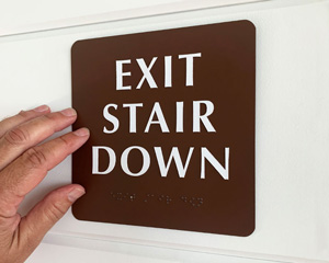 Braille exit down stair sign