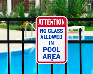 No glass allowed in pool area sign
