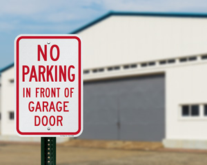 No Parking in Front of Garage Door Sign