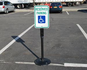 Reserved handicapped parking sign on a stand