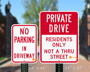 Two sizes of private driveway signs