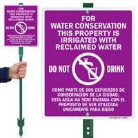 Bilingual Water Conservation Property Is Irrigated Sign