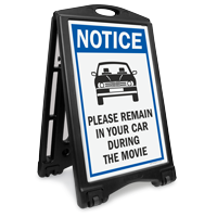NOTICE: Please Remain in Your Car During the Movie Sidewalk Sign