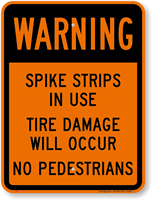 Spike Strips In Use Tire Damage Sign