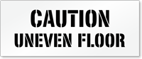 Caution Uneven Floor Pavement And Parking Stencil