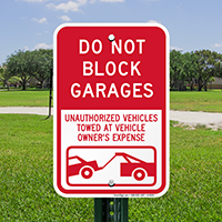 Do Not Block Garages Unauthorized Vehicles Towed Signs