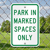 Park in Marked Spaced Only Sign