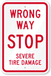 Wrong Way   Stop Severe Tire Damage Sign