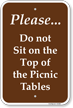 Please Do Not Sit On The Top Of Picnic Tables Sign