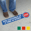 Stop One Customer At A Time In Store SlipSafe Floor Sign