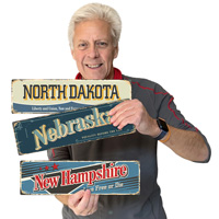 Retro-style North Dakota sign featuring state motto