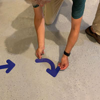 Blue right arrow floor marker