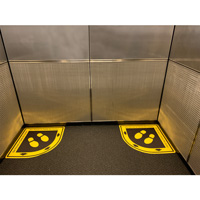 One person per corner of elevator signs